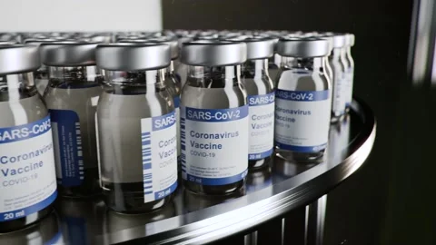 COVID vaccine bottles production loop Stock Footage