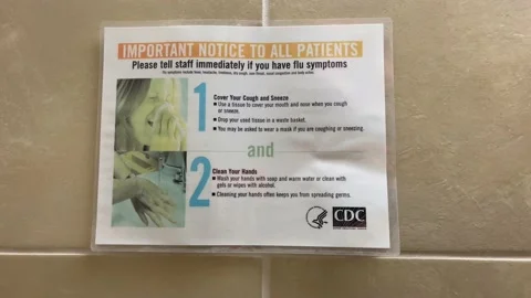 COVID warning sign in bathroom  Stock Footage 168908804