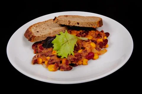 Cowboy beans with bread on a black 스톡 사진