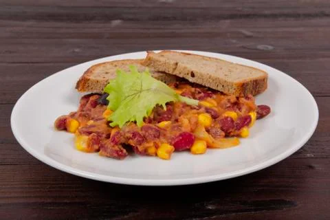 Cowboy beans with bread on a table 스톡 사진