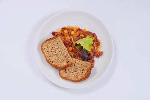 Cowboy beans with bread on a white Foto stock