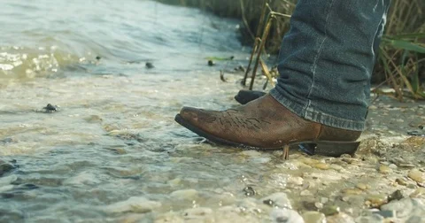 Cowboy boot in the beach Stock Footage 83695568