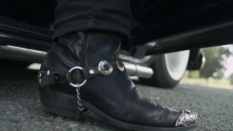 Cowboy boot steps out of a classic truck 库存影片 118641308