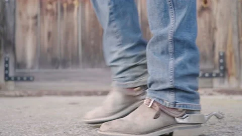 Cowboy boots with spurs walk close-up slow motion 4K Stock Footage