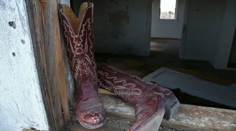 Cowboy Boots in Window at an Abandoned Ranch Stock Footage 33873392