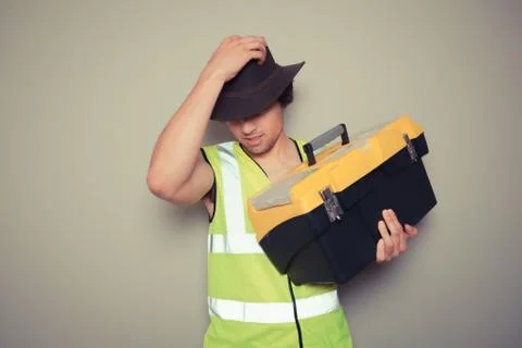 Cowboy builder with tool box Stock Photos