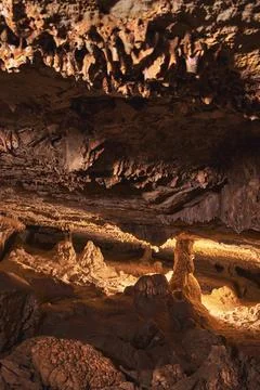 Cowboy Canyon Cave Interior With Dramatic Stalactites Stalagmites And Light.. Stock Photos
