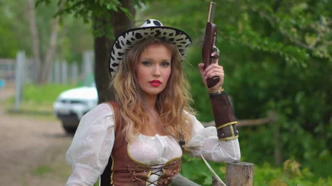 Cowboy girl posing at ranch Stock Footage 151748383