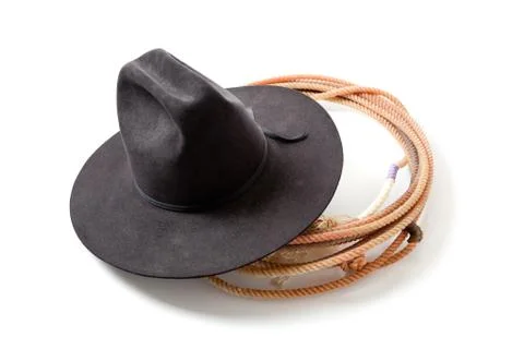 A cowboy hat and lariat on white Stock Photos