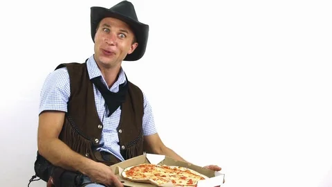 Cowboy in hat eats pizza on white background Stock Footage 101697170
