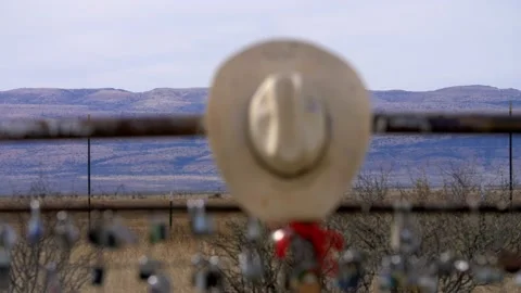 Cowboy hat mountain rack focus Stock Footage 229821465