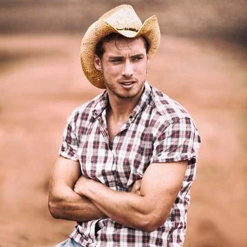 Cowboy hat sexy handsome american man in USA countryside farm. Farmer in plaid Stock Photos
