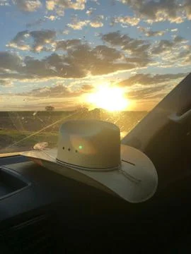 Cowboy hat at sunset Fotos de archivo