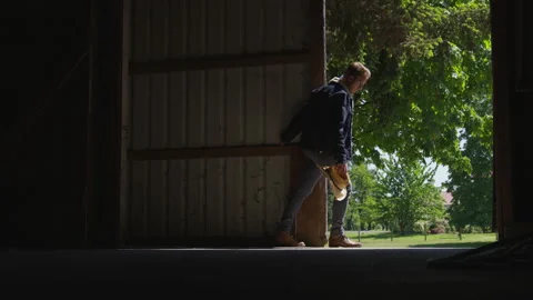 Cowboy Pulls Barn Door Closed Video stock 208724352
