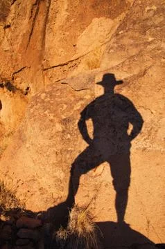 Cowboy shadow on rock Stock Photos