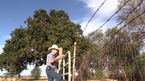Cowboy , Sheriff and barbwire Stock-Footage 30488446