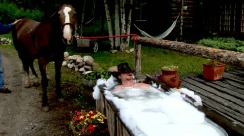 Cowboy Taking a Bath Stock Footage 22019277