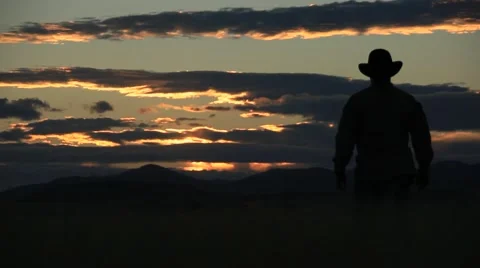 Cowboy Tips His Hat at the Sunset Stock Footage 40795102