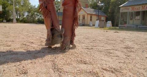 Cowboy Walking Through the Dirt, Close Up of Boots in Town Stock Footage