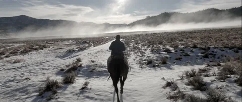 Cowboy in the winter Stock Footage 238405808