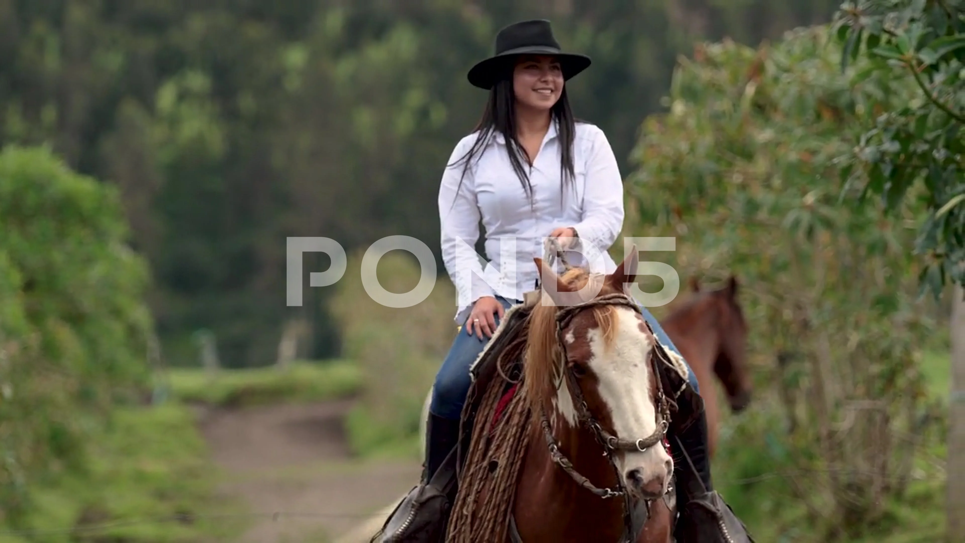 cowgirl riding horse