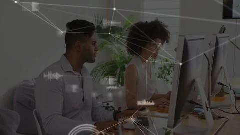 Coworker duo typing and collaborating in tech hub, initiating network overlay Stock Footage 333062627