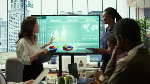 Coworkers engaging in a problem solving meeting at a corporation Stock Footage 318226264