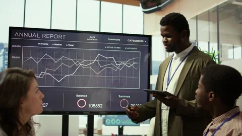 Coworkers engaging in a problem solving meeting at a corporation Stock Footage 318232102