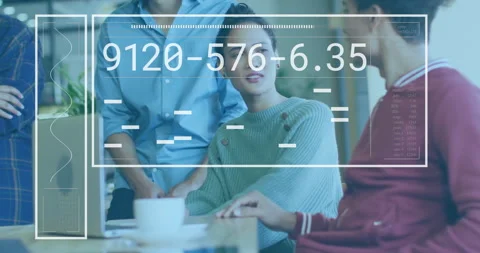 Coworkers reviewing data on laptop while overlay updating numeric codes driving Stock Footage 309895214