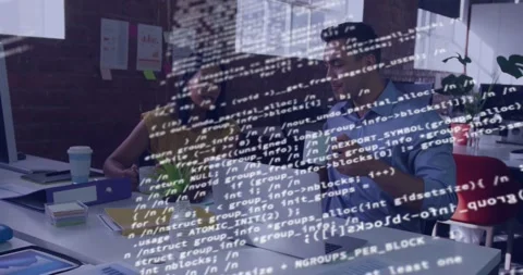 Coworkers reviewing laptop, debugging code, woman pointing, code overlay Stock Footage 332284984