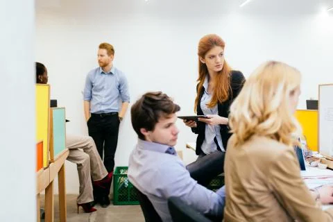 Coworkers solving problems together 写真素材