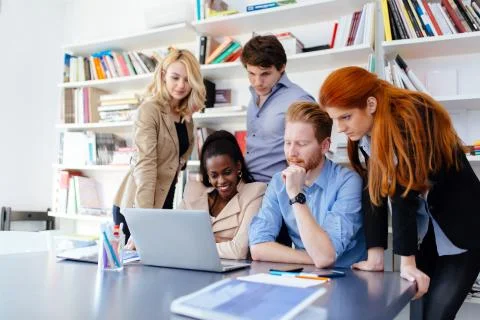 Coworkers solving problems together Stock Photos