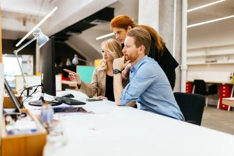 Coworkers solving problems together Stock Photos