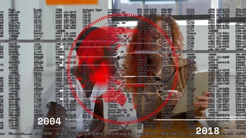 Coworkers tapping tablet screen in office while animated red map and code Stock Footage 330470097
