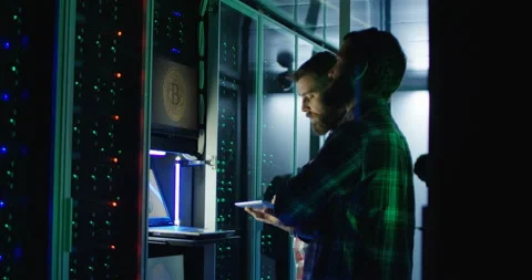 Coworking engineers setting mining farm hardware Stock Footage 97172586