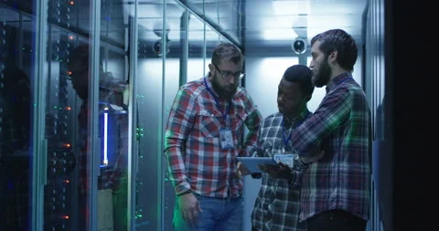 Coworking IT engineers diagnosing server hardware Stock Footage 97150183