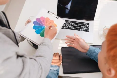 Coworking process, designers team  working on computer in modern office. Stock Photos