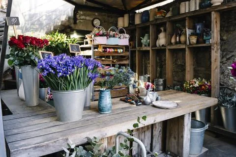 Cozy and authentic rustic flower shop counter with dried lavender and vintage Stock Photos
