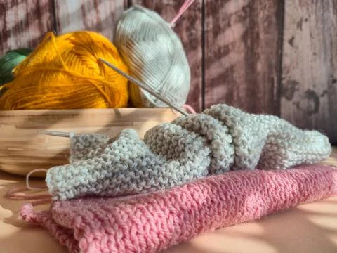 Cozy and Inviting Knitting Setup Featuring a Variety of Colorful Yarns and .. Stock Photos