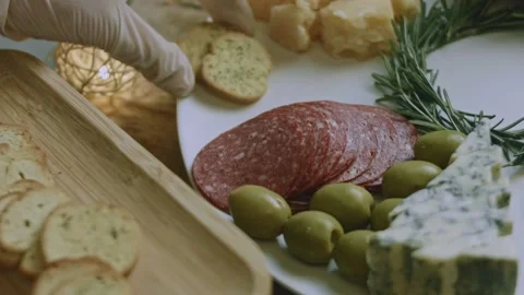 Cozy angled preparation of placing nuts among the cheese Stock Footage 342139602