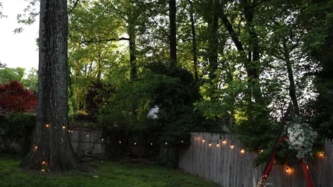 Cozy backyard with string lights at dusk 動画素材 337728650