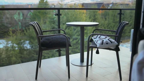  Cozy balcony terrace with outdoor chairs and table at resort hotel. Stock Footage 340341753