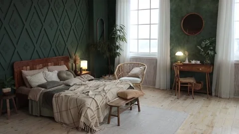 Cozy bedroom interior in boho style with emerald walls, wooden furniture Stock Footage 233764573