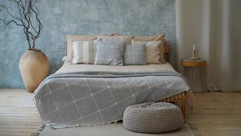 Cozy bedroom with a large window Stock Photos