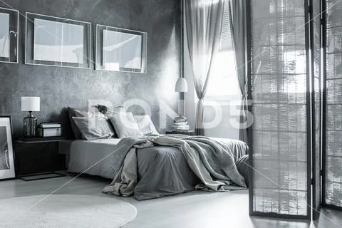 Cozy bedroom with simple accessories Stock Photos