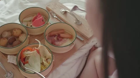 Cozy Breakfast in Bed with Assorted Dishes Stock Footage 329374749