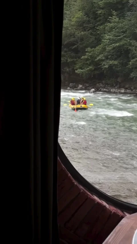 Cozy Cabin Room Overlooking Rushing River and Rafting Stock Footage 340564109
