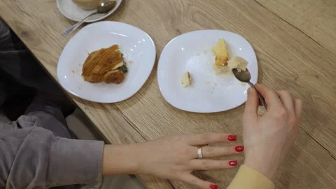 Cozy cafe hands sharing cake Stockbeeldmateriaal 336443317