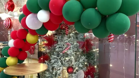 Cozy cafe interior with christmas tree and decorations, warm festive atmosphere Stock Footage 335726648