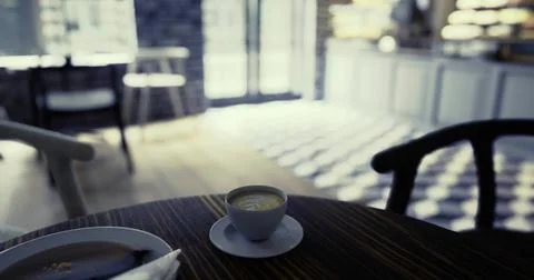 Cozy cafe interior with coffee and pastry on a wooden table in bright light Illustrazione stock